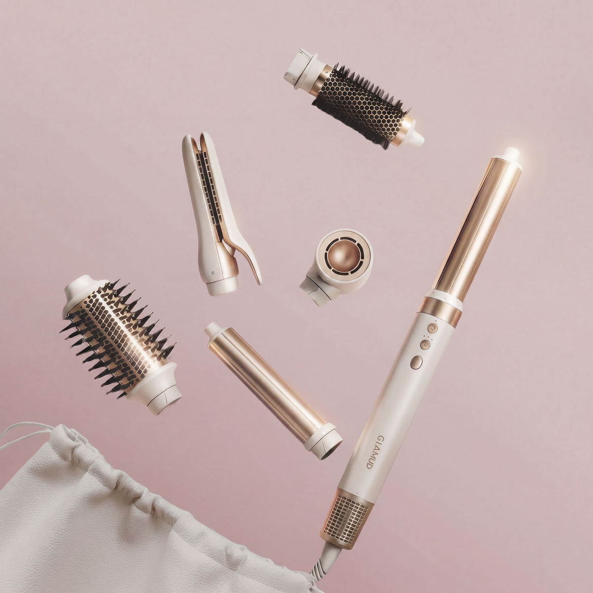 The white and gold premium GLAMUP multi-styler system laid out with its interchangeable engineering styling attachments, including an air curling barrel, volumizing brush, and dryer. The white and gold premium GLAMUP multi-styler system laid out with its interchangeable engineering styling attachments, including an air curling barrel, volumizing brush, and dryer.