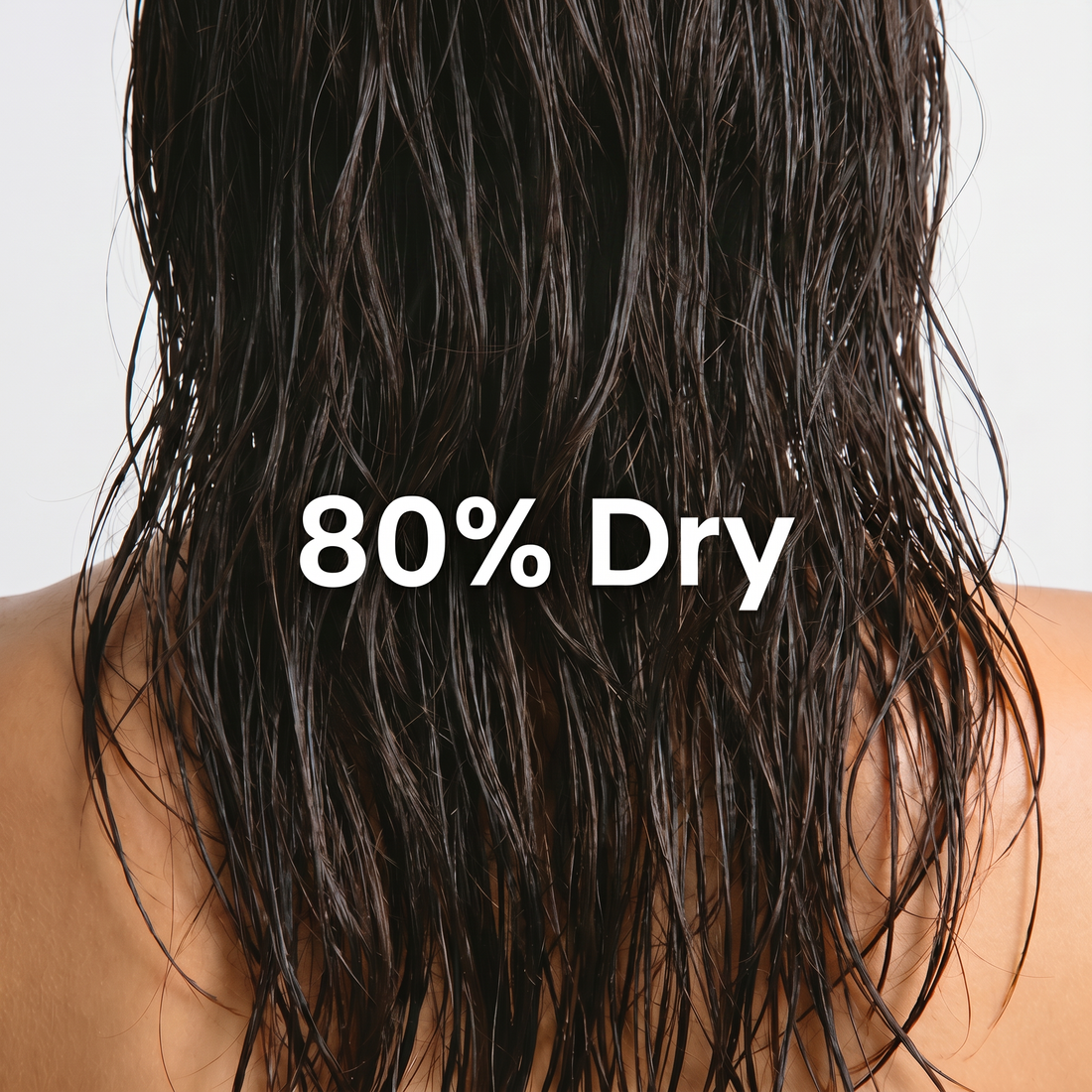 Back view of dark wet hair with text reading 80% Dry