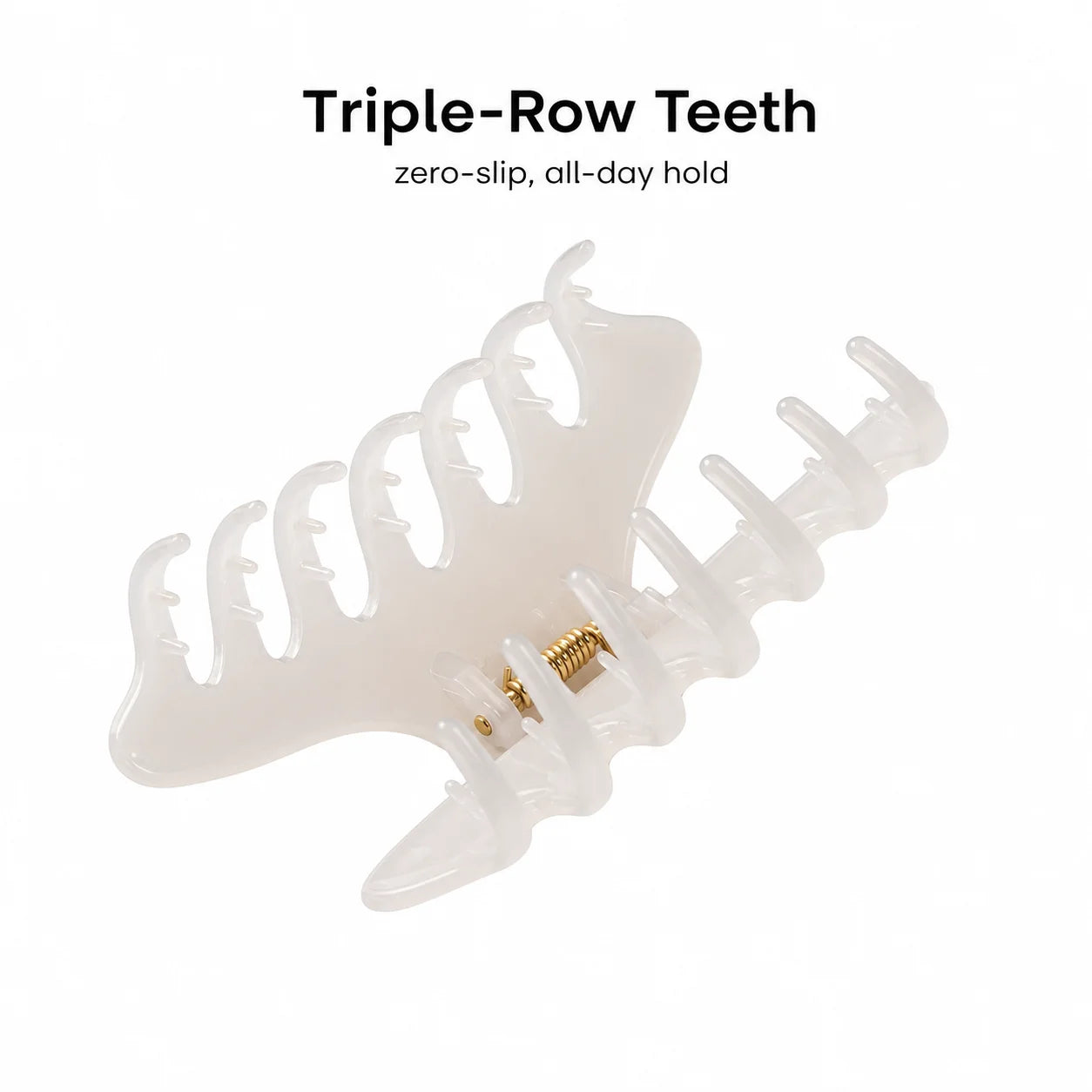 A translucent white acrylic claw hair clip with triple-row teeth and a small gold metal spring, shown on a white background with text reading 'Triple-Row Teeth' and 'zero-slip, all-day hold'.