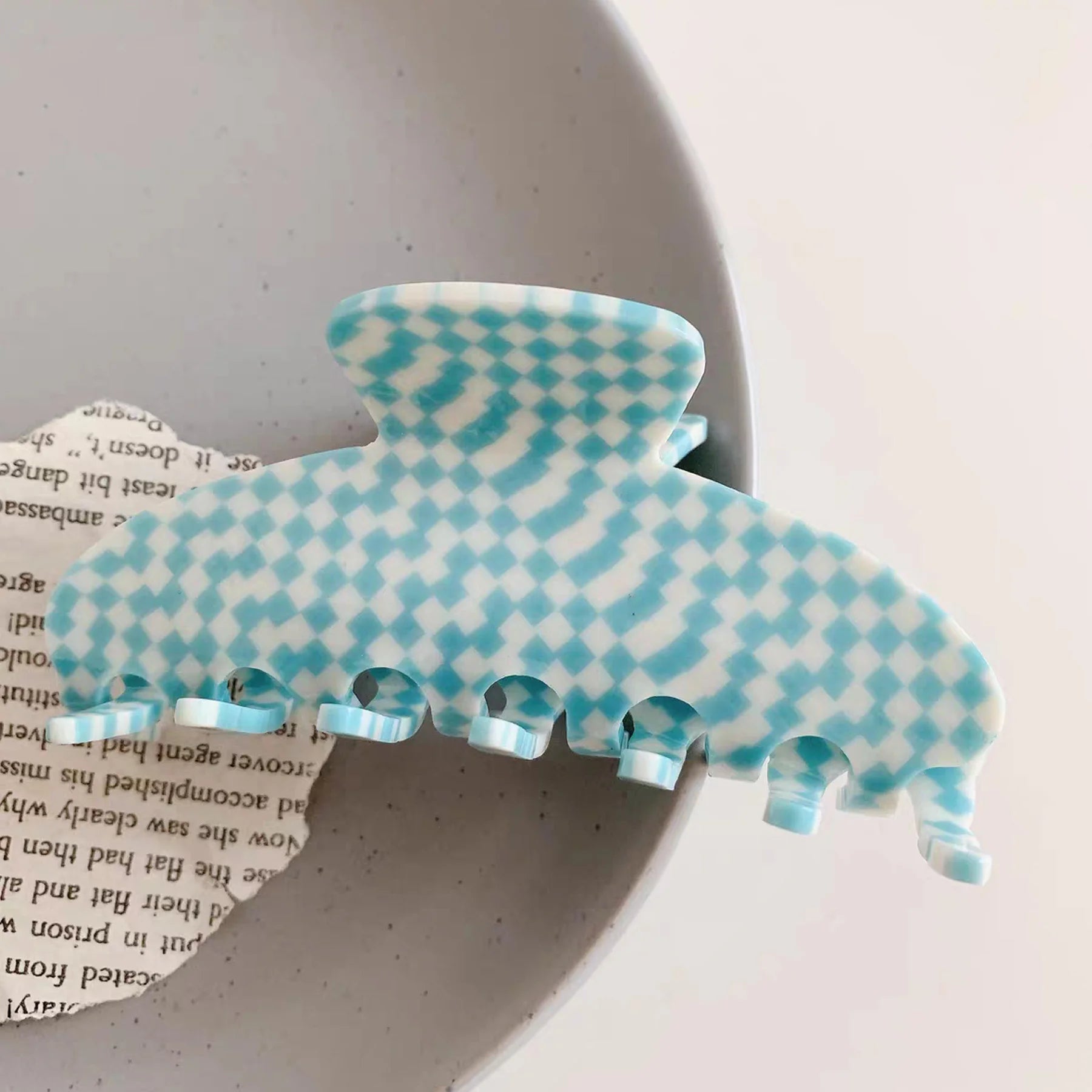 Detailed close-up of the blue checkered Glamup extra large XL size claw clip, featuring a sturdy build for all day hold.