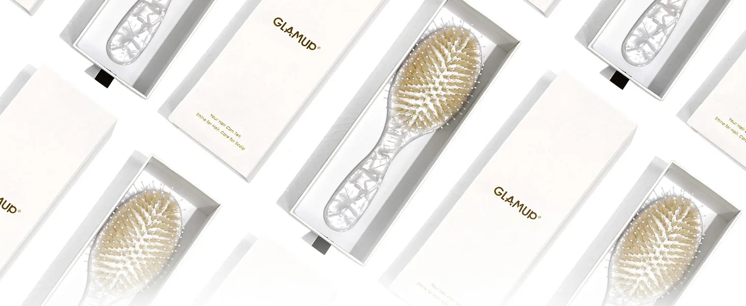 An elegant array of Glamup white marble acetate boar bristle hair brushes in premium magnetic closure gift boxes. The ultimate luxury gift for her, suitable for holidays, birthdays, or special occasions.