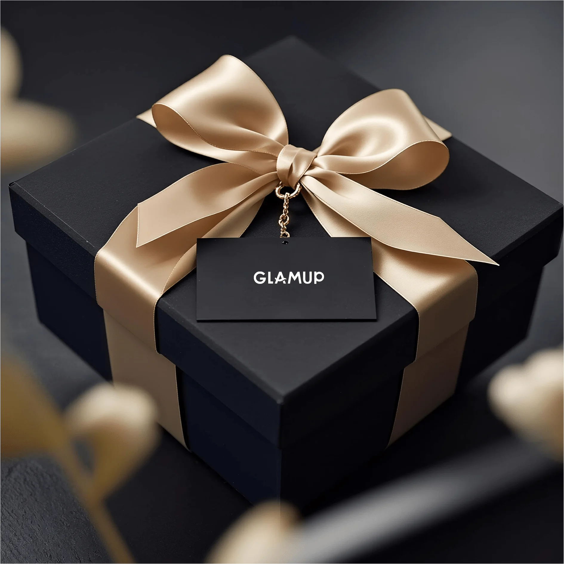 GLAMUP luxury black gift box with a champagne gold ribbon bow, elegant gift for women.