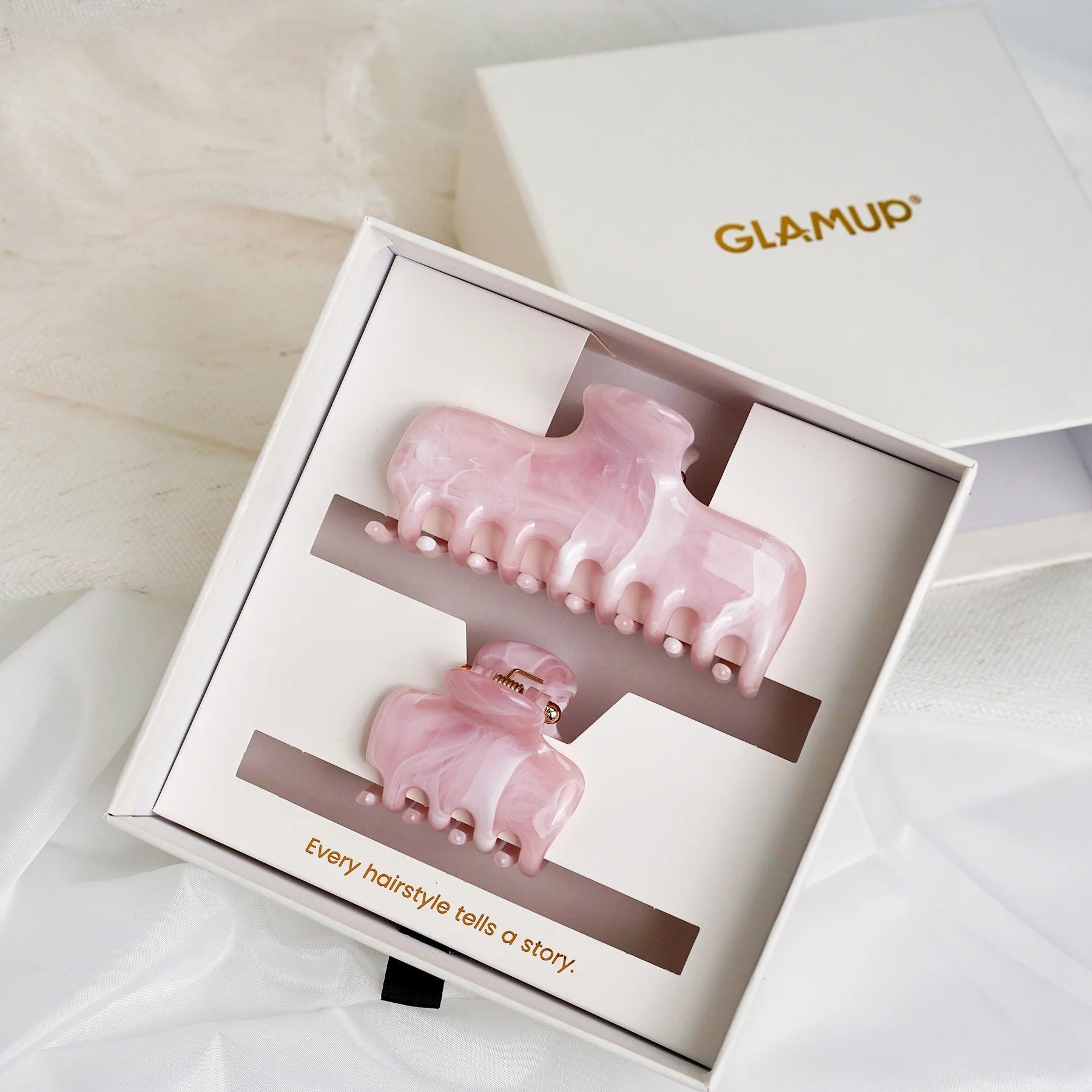 Elegant gift box packaging for the Glamup "The Jennie" pink marble claw clip set, ready for gifting.