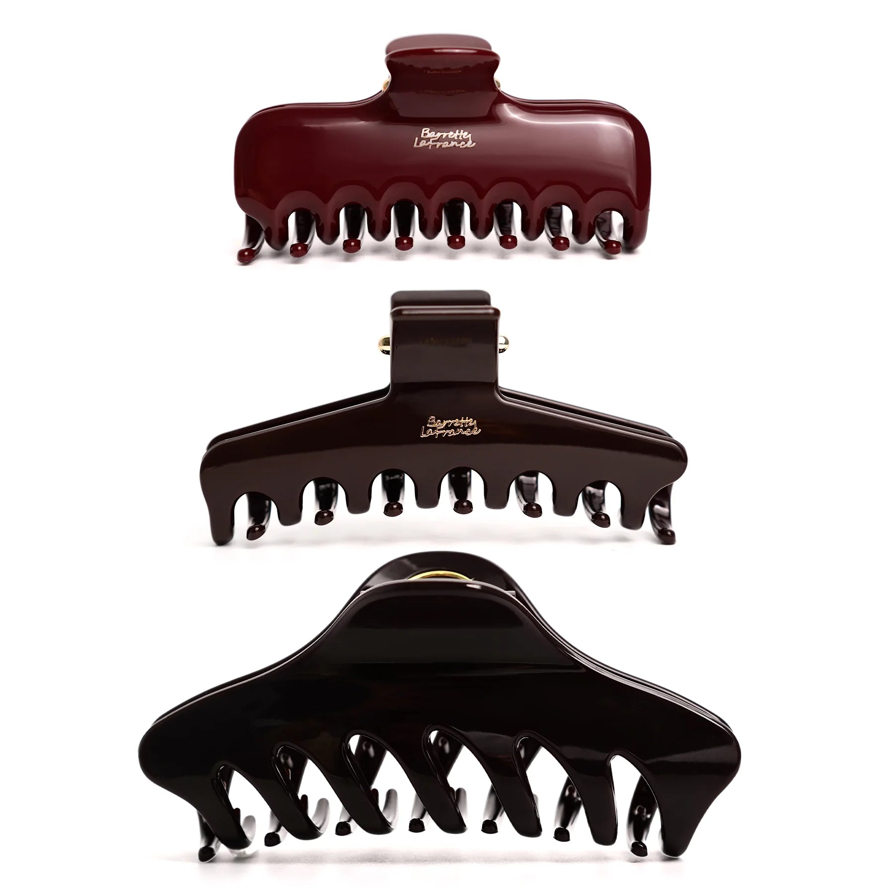Studio display of the Glamup The Taylor claw clip for thick hair in a dark color set, featuring an XL jumbo size and double-row teeth for all-day hold.